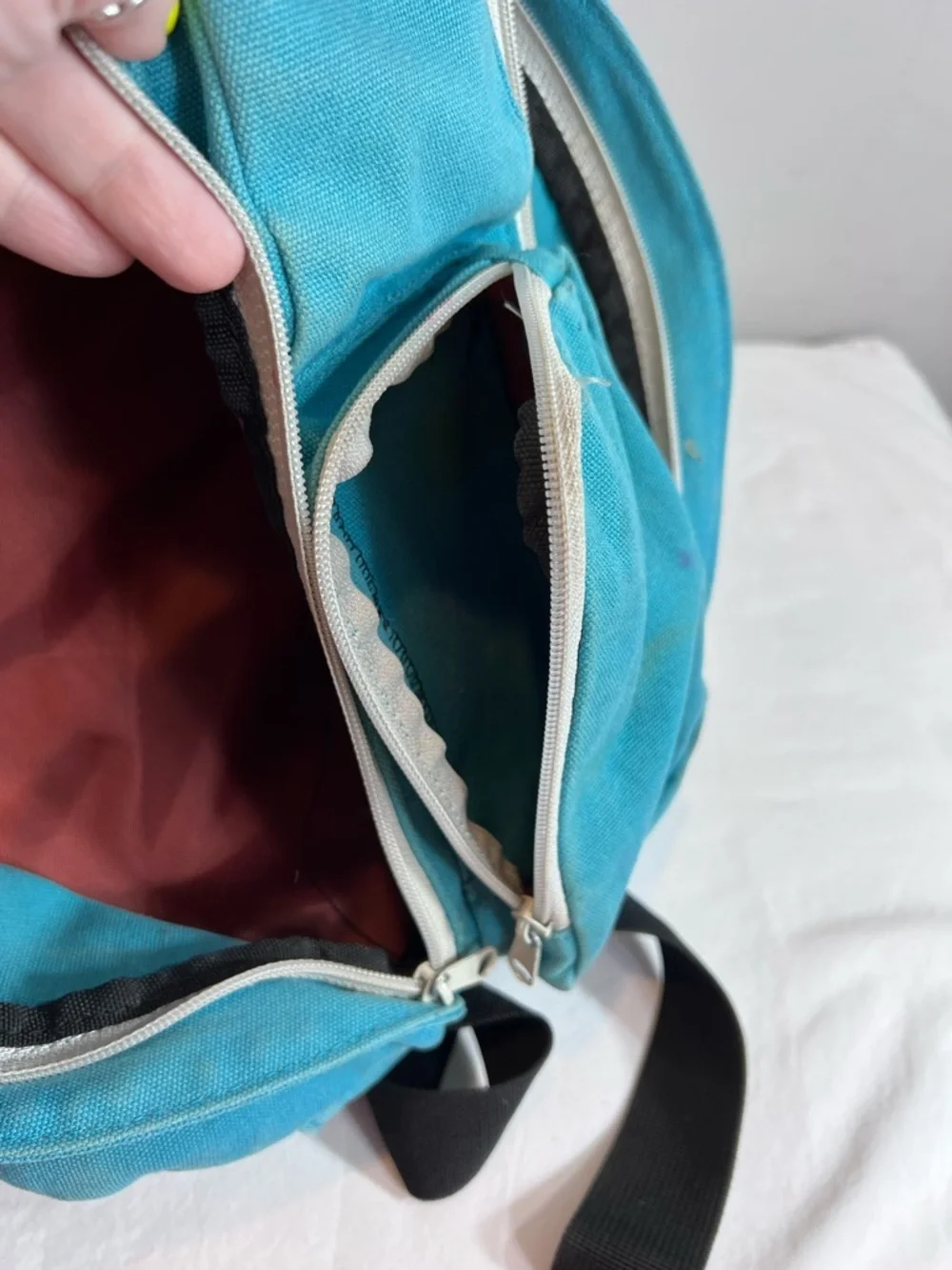 Kavu teal rope sling bag backpack